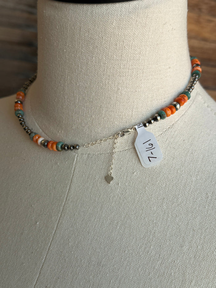 Turquoise and orange bead necklace clasp with silver-tone connector