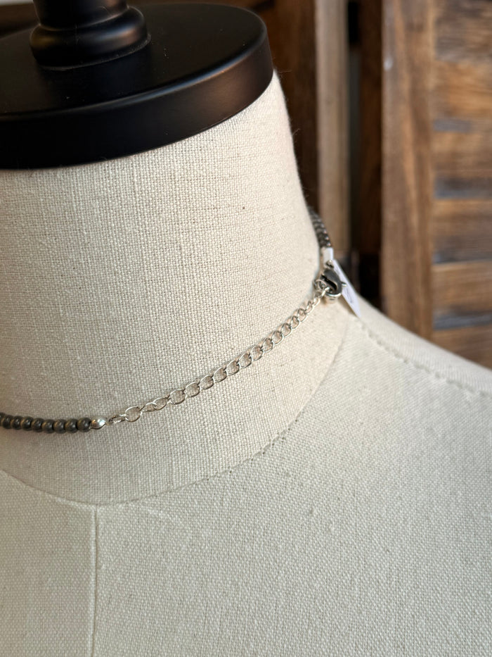 Silver-tone chain necklace with turquoise rectangle pendant and link detail