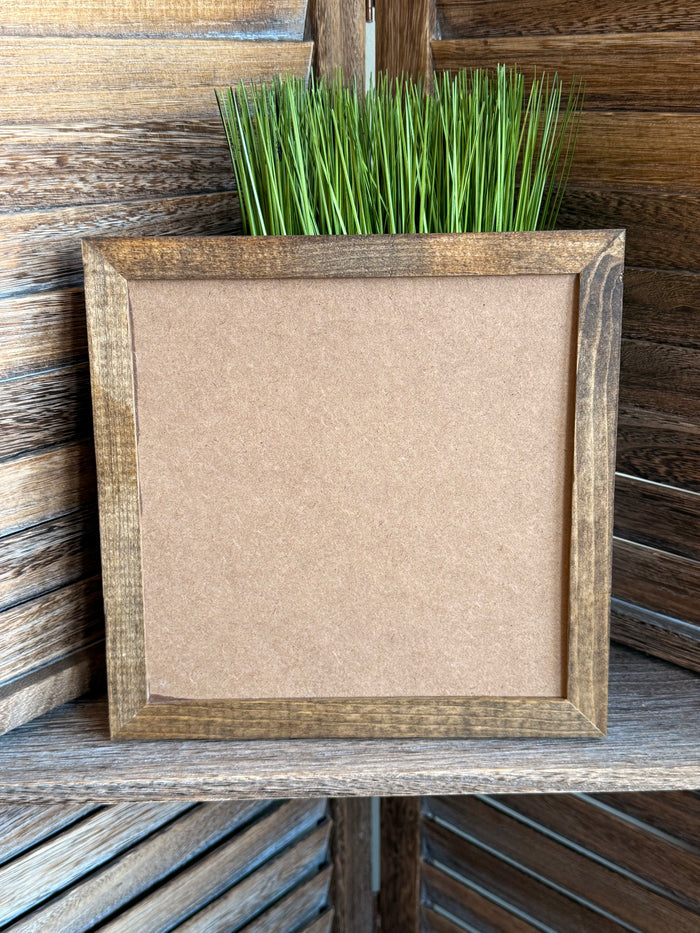 Blank framed wall art with weathered gray wood frame and off-white backing