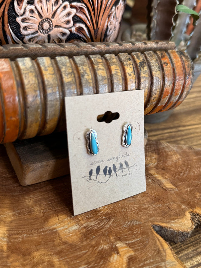 Silver and turquoise teardrop stud earrings with blue stone teardrops on posts.