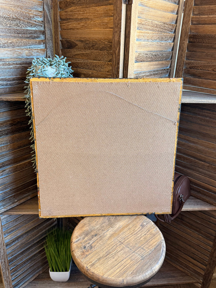 Back of framed artwork with plain beige panel and distressed blue frame