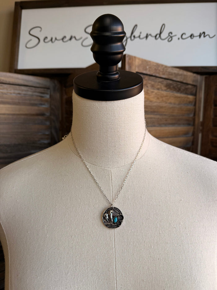 Coin necklace with round silver-toned stone pendant on thin V chain