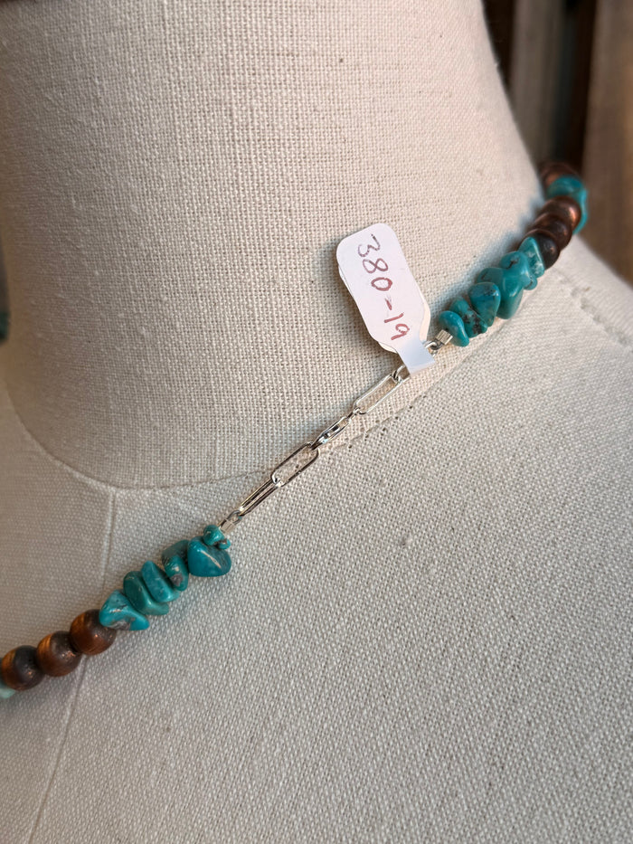 Turquoise bead necklace clasp end with metal hook and small number tag