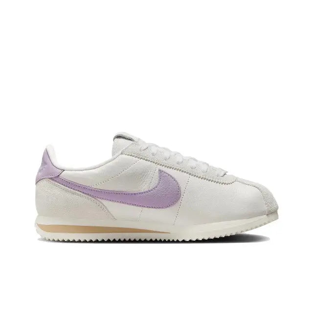 Cortez sneakers side view, lilac Swoosh on beige upper