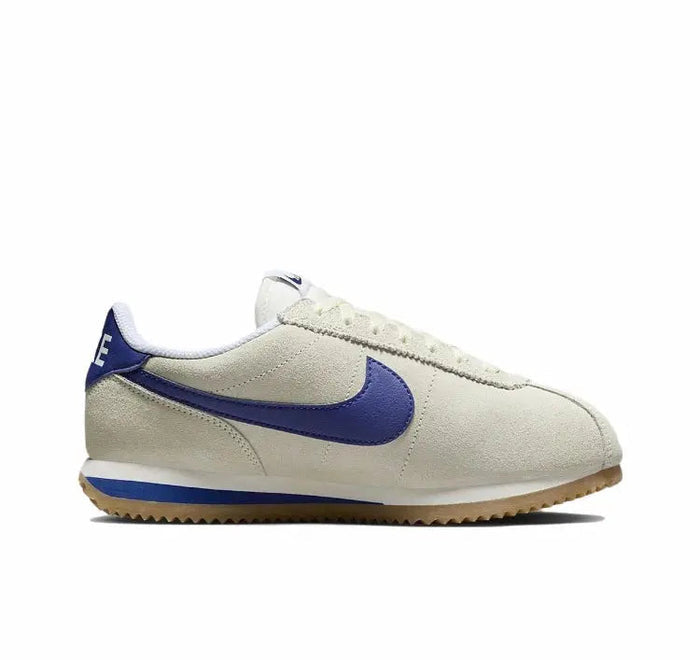 Cortez sneaker side profile in off-white leather with blue swoosh
