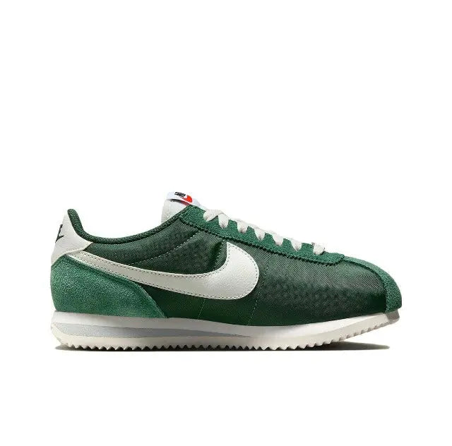 Nike Cortez sneakers in dark green with white Swoosh and ribbed collar trim.