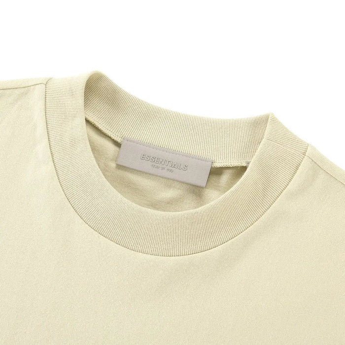 Light yellow T-shirt crewneck with small interior neck tag