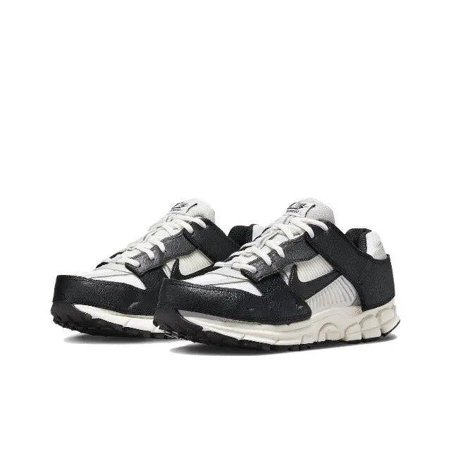 Nike Zoom Vomero 5 SP running shoe pair in black and light bone with chunky midsole