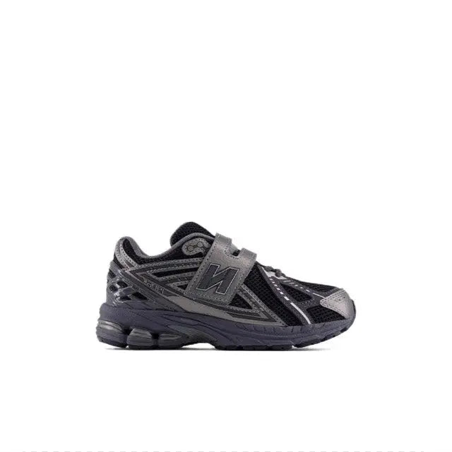 Black lace-up running shoes with gray overlays and cushioned midsole