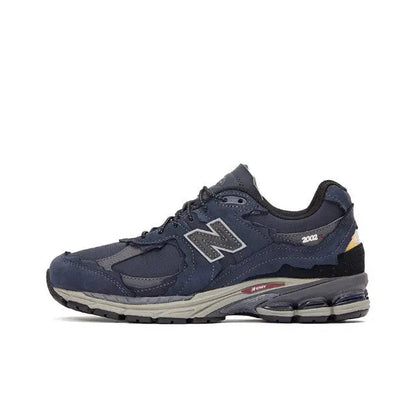 Navy New Balance 2002R running shoes with gray N logo, lace-up, chunky sole