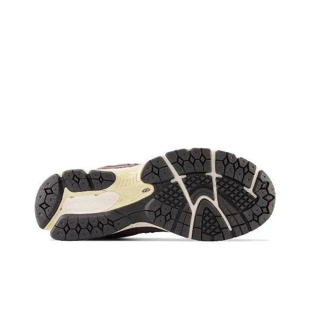 New Balance 2002R outsole tread view, dark rubber with white midsole