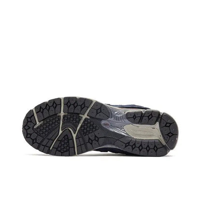 Navy New Balance 2002R outsole view with patterned tread and cushioned midfoot