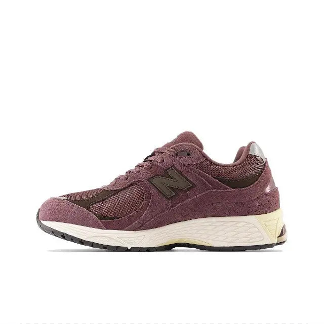 New Balance 2002R maroon running sneaker side profile with off-white sole