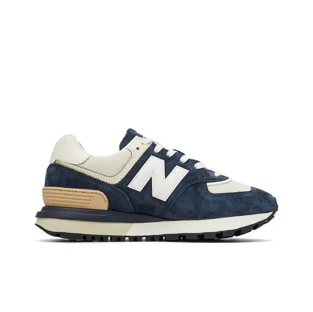 Retro running sneaker in navy and cream with tan accents and N logo