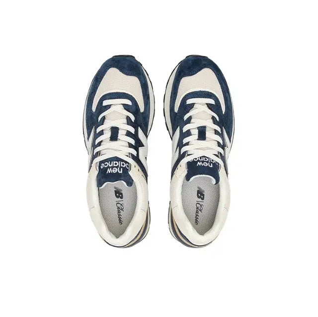 Retro running sneaker pair, navy and cream uppers with white laces