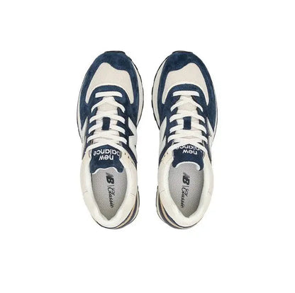 Retro running sneaker pair, navy and cream uppers with white laces