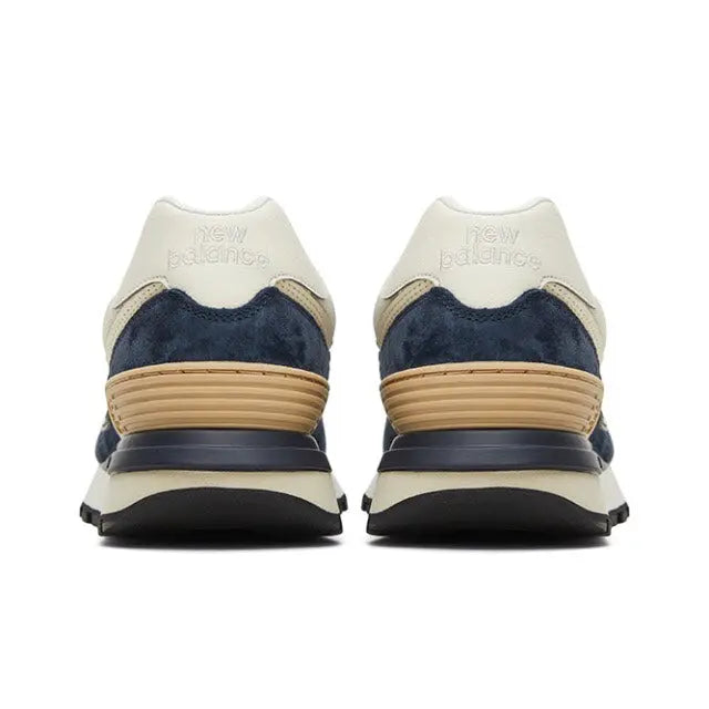 Retro running sneaker heel view, cream uppers with navy panels and tan stripes