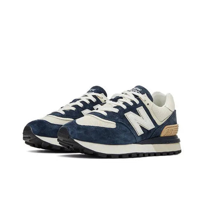 Retro running sneaker side view, navy suede with cream overlays and tan heel