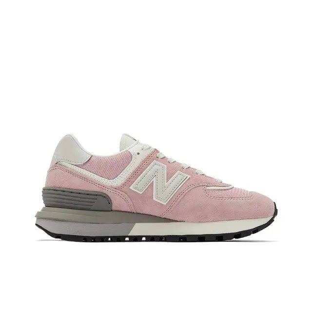 New Balance 574 pink suede sneaker with white N logo, gray accents, black sole