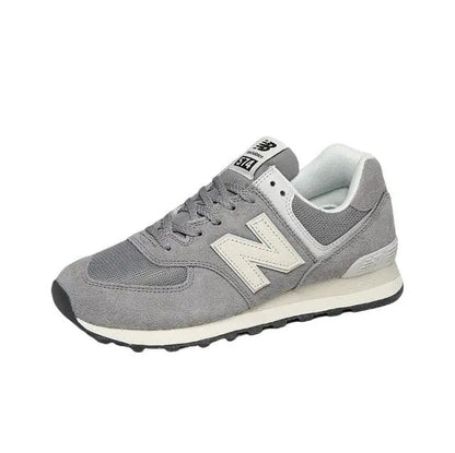 Grey low-top lace-up sneaker with off-white New Balance N logo and textured sole