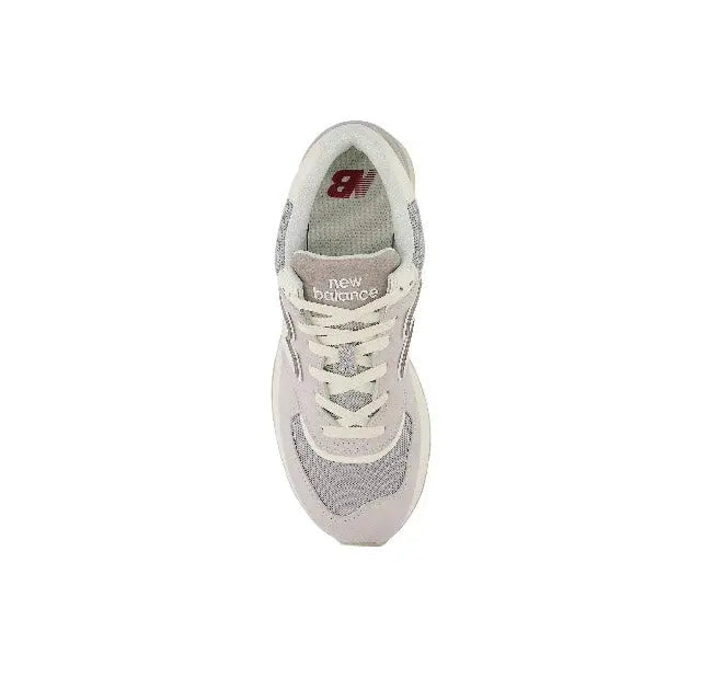 New Balance 574 sneaker, heel and insole view with red '8' tag and lace-up top