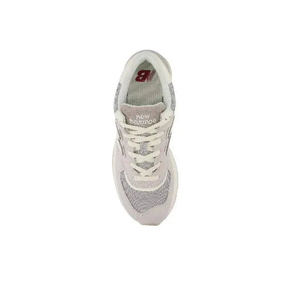 New Balance 574 sneaker, heel and insole view with red '8' tag and lace-up top