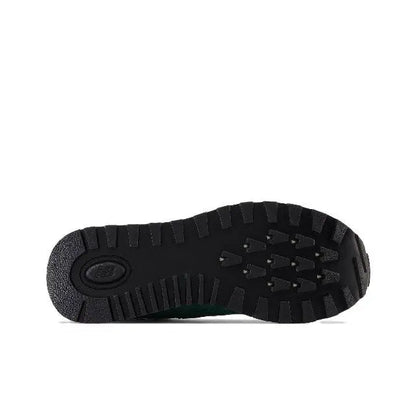 574 sneaker outsole, dark tread with circular logo in the center