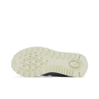 Apollo Grey 574 sneaker outsole with textured tread and circular logo