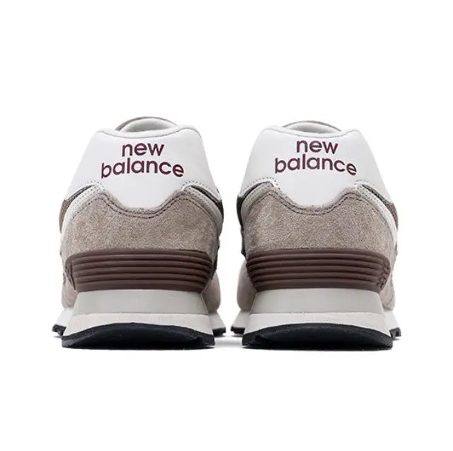 New Balance 574 sneakers, brown heel panel with white back and new balance text