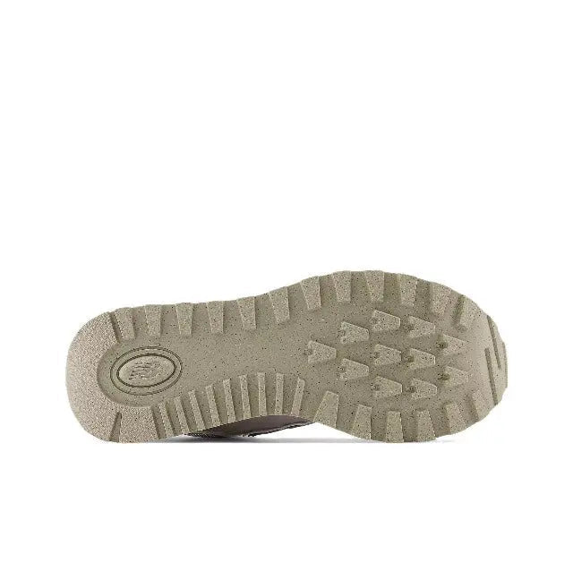 New Balance 574 sneaker outsole with rugged tread pattern in tan-grey
