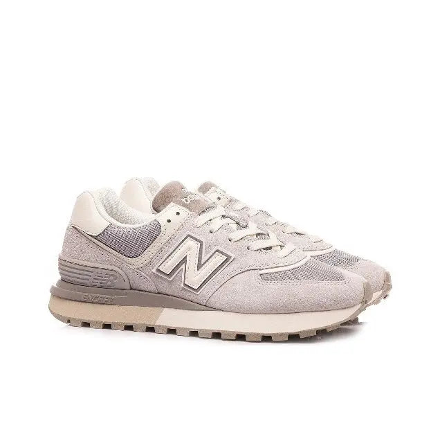 New Balance 574 low-top sneaker in light grey with off-white accents, front view, lace-up