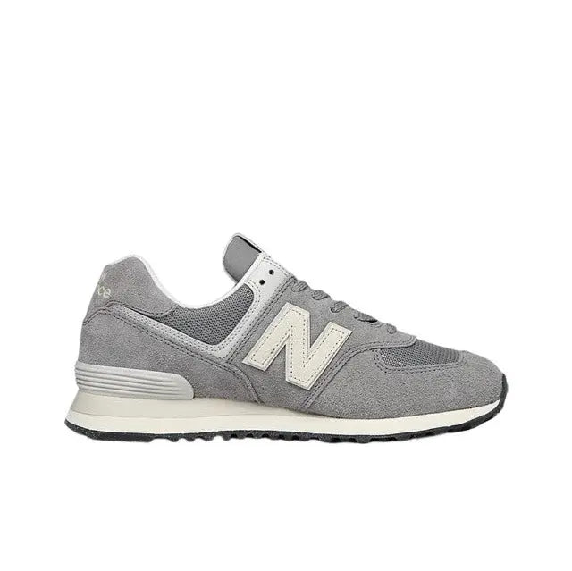 Grey low-top lace-up sneaker front/side view with off-white N logo and cream trim