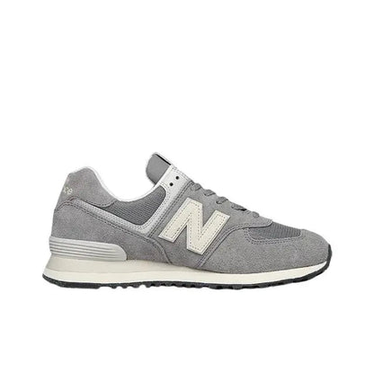 Grey low-top lace-up sneaker front/side view with off-white N logo and cream trim