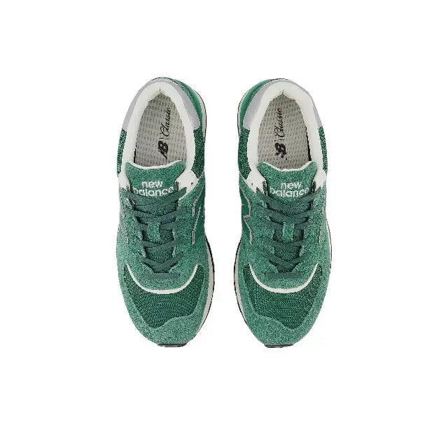 574 sneaker pair, green uppers with white trim and woven lace eyelets
