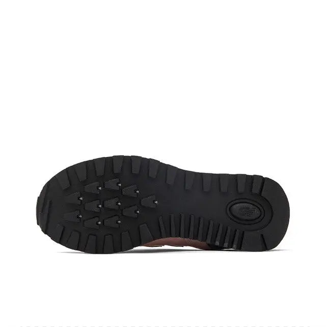 New Balance 574 sneaker outsole with black tread and circular heel logo