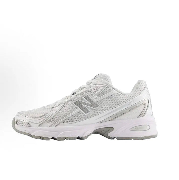 White lace-up running sneaker with metallic gray N logo and chunky rubber sole