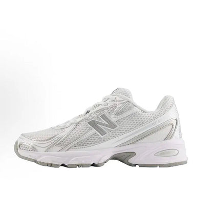White lace-up running sneaker with metallic gray N logo and chunky rubber sole