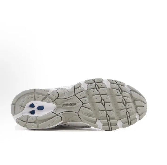 White lace-up sneaker outsole view with grippy tread and cushioned midsole