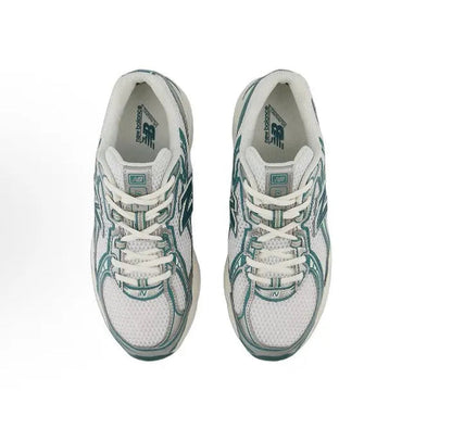 Lace-up running sneaker pair, white mesh uppers with teal-green trim