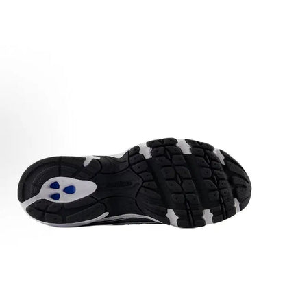 Running shoe outsole with black tread and blue logo mark