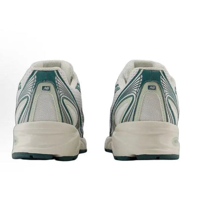Running sneaker heels, white uppers with green patterned panels and cushioned back