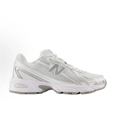 White lace-up running sneaker with metallic gray accents and chunky treaded sole
