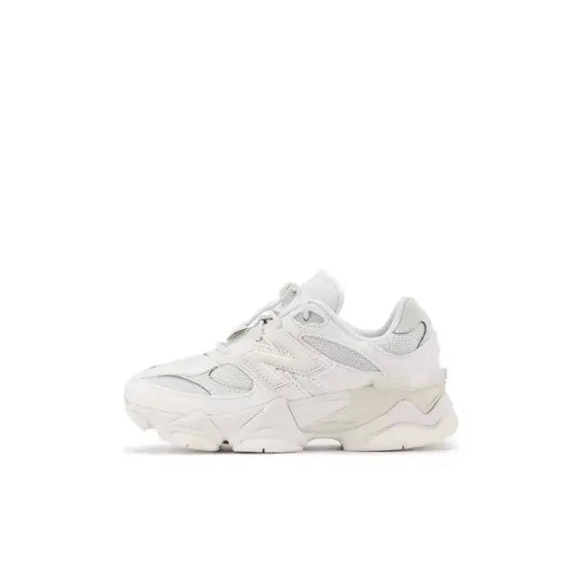 New Balance 9060 white low-top lace-up sneaker with layered panels and rubber sole