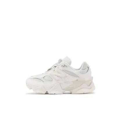 New Balance 9060 white low-top lace-up sneaker with layered panels and rubber sole