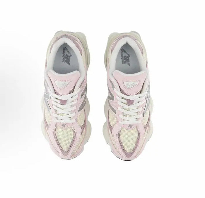 Pink and cream lace-up sneakers viewed from above with padded tongue and N logo