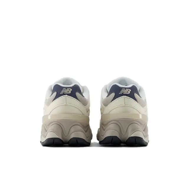New Balance 9060 sneaker heel view with navy collar and NB logo
