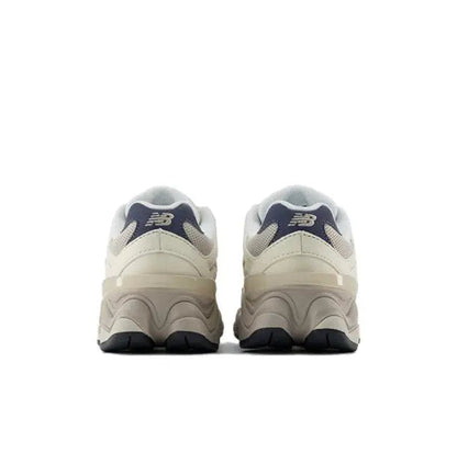 New Balance 9060 sneaker heel view with navy collar and NB logo