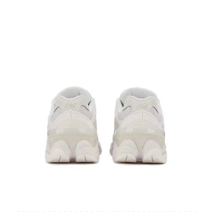 New Balance 9060 white heel pair view with cushioned back and lace-up closure