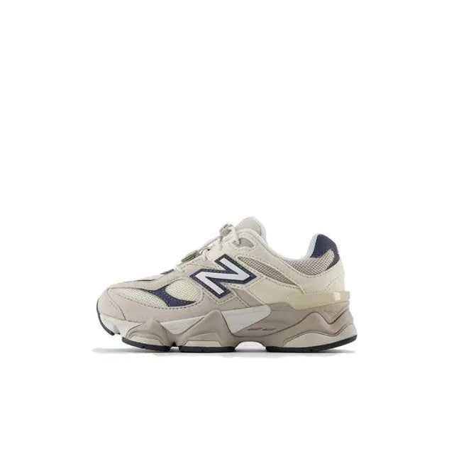 New Balance 9060 sneaker side view, beige leather with navy N branding