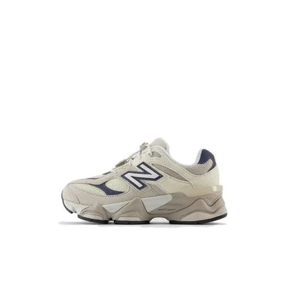 New Balance 9060 sneaker side view, beige leather with navy N branding